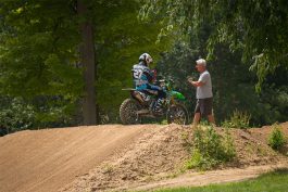 Terry Wey chatting with his son Nick Wey on the triple at Martin MX Park